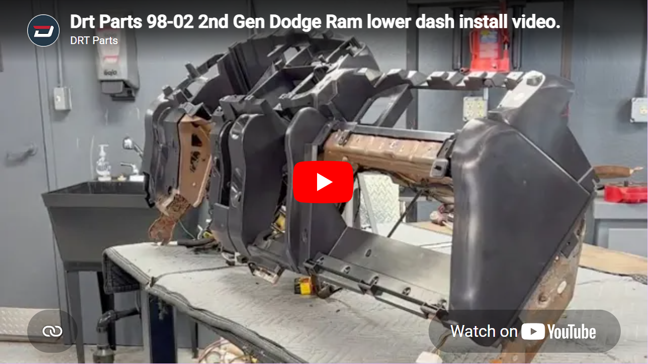 Video thumbnail for a YouTube tutorial: installing the 98-02 2nd-gen Dodge Ram lower dash, showing the metal dash frame on a workbench.